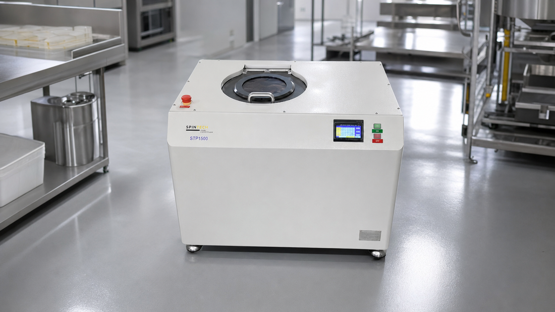 Planetary centrifuge installed in a clean modern industrial processing lab.