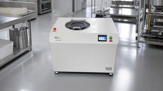 Planetary centrifuge installed in a clean modern industrial processing lab.