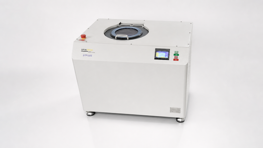 planetary centrifuge vs basket centrifuge comparison featuring a Spin Tech STP-1500 in a clean studio setting